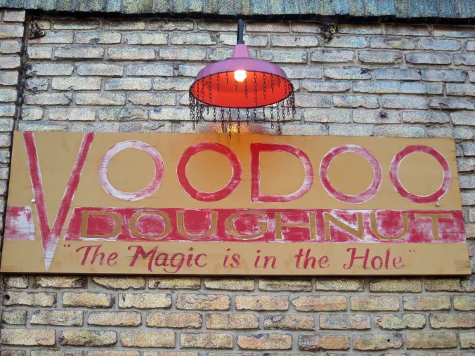 This sign welcomes customers to the shop.