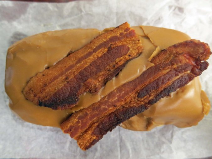 I am convinced this is a new definition of sin— a bacon maple bar from Voodoo Donut shop in Portland. The donut shop was located next to the Press publish Conference I was attending in Portland, Oregon.