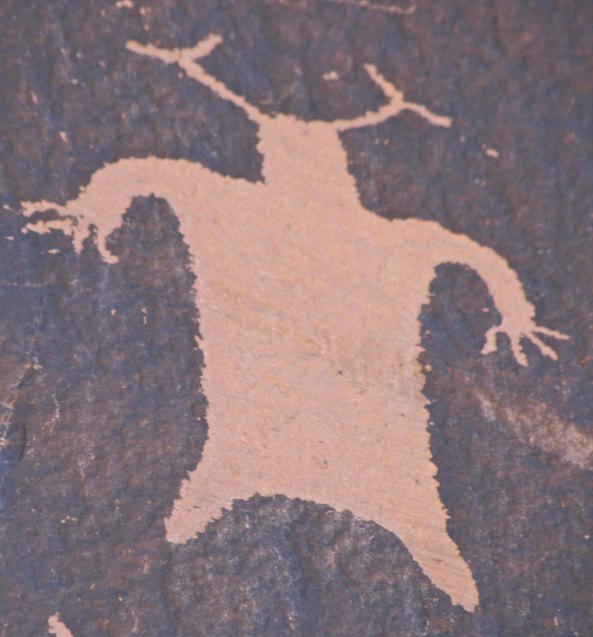 Man With Antlers practices flying leap.