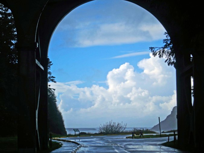 Looking out from a span of the Cape Creek Bridge onto the small ocean cove the creek empties into.