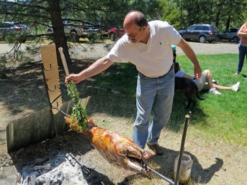 Spices and oil are bushed on the goat by Brian's brother-in-law Kieth. The brush is also made of spices such as rosemary and sage.