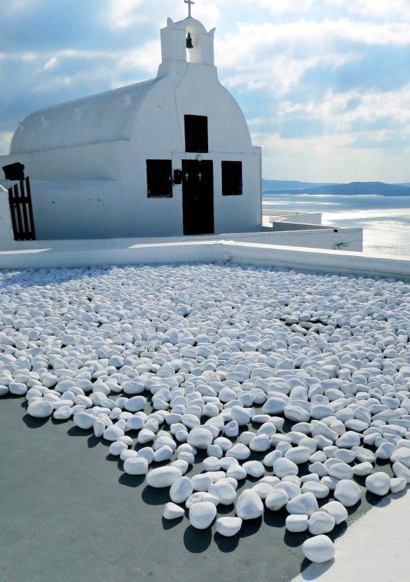 Think of the imagination that went into the decision to put white rocks in front of this white church.