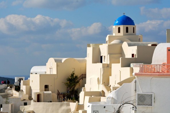 It is a combination of the blue domes, unique architecture, magnificent setting and Mediterranean light that make the many churches in Oia so outstanding. (Photo by Peggy Mekemson.)