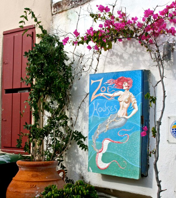 Certainly one would expect to find mermaids lulling around on the rocks off of Santorini. The bougainvillea  made a nice frame.