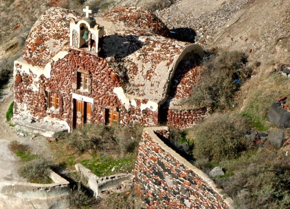 This looked like a very old church to me. Notice how it is built into the cliff. (Photo by Peggy Mekemson.)