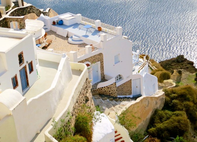 Perched on the remaining wall of an ancient volcano, the Greek town of Oia overlooks the Aegean Sea.