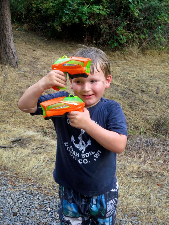 Chris proves to me that his water pistols are functioning and ready for action.