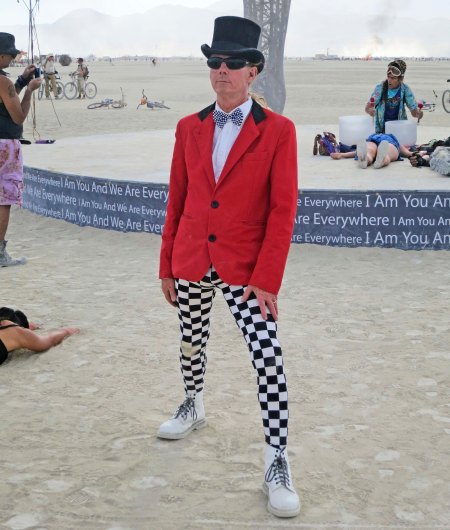 Costumes are big at Burning Man, as are the dust storms seen in the background.