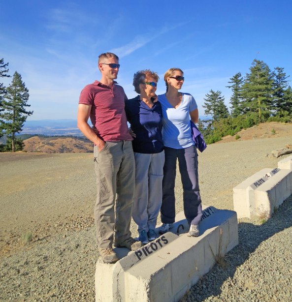 Tony, Peggy and Tasha stand on the pilots block and prepare for their assisted paragliding adventure.