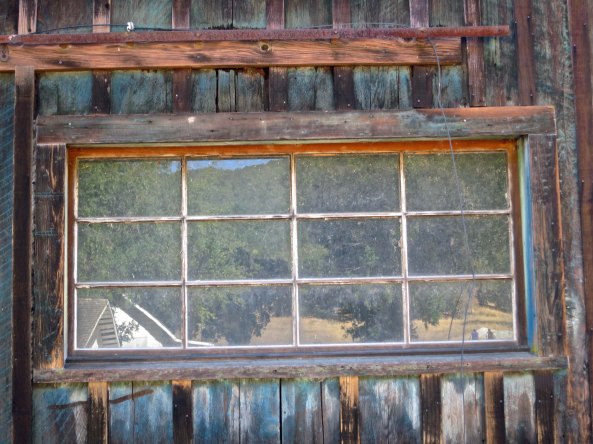 Reflections caught in one the barn's windows.