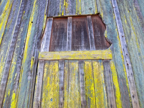 This old, boarded up window on the barn had personality plus. Animals must have chewed away at the right side.