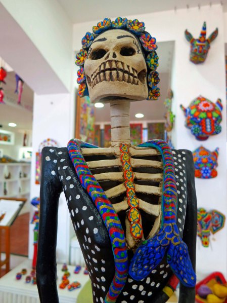 Miniature Catrinas, such as this one, and their male counterparts are created to sell to people who don't have have room, or the money, to buy a big one. Many are quite beautifully made with fine attention to detail.