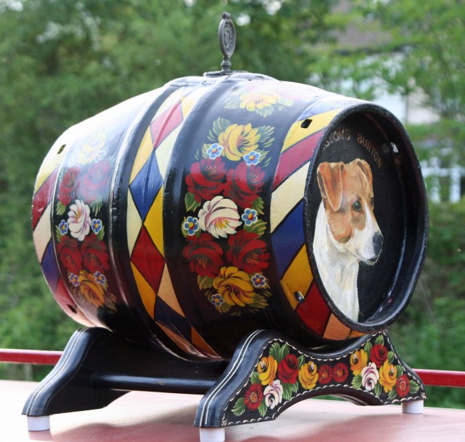 We spotted this water cask with its realistic portrayal of a dog on top of a narrowboat. 