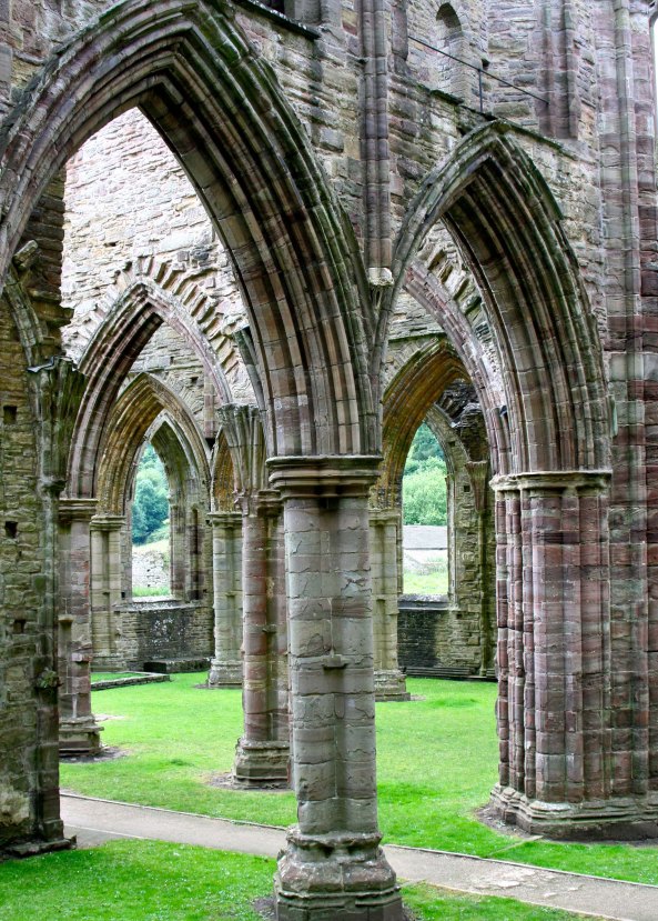 Graceful columns found when stepping inside the ruins of Tintern Abbey.
