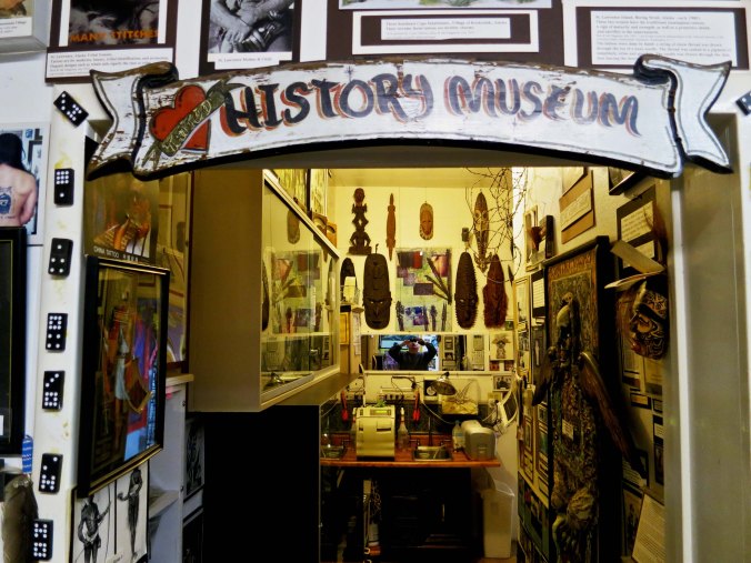 The doorway to the Triangle Tattoo Museum. You are welcomed by native masks.