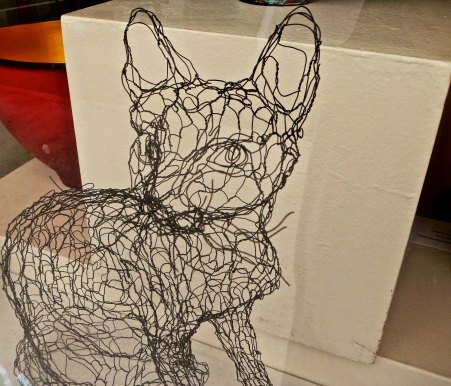 Shops feature everything from crafts to very good art. I found this cat in a shop next to the book store and was amused/impressed by the creative use of chicken wire.