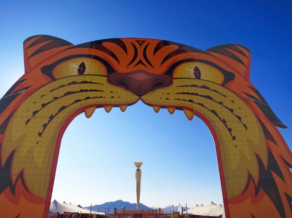 One of four gateways to the 2015 Burning Man carnival. William Blake's poem "TIGER, tiger, burning bright. In the forests of the night,. What immortal hand or eye. Could frame thy fearful symmetry?" was printed around the edge.