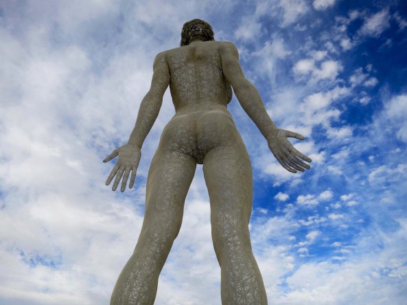 The 48 foot sculpture R-Evolution looks across the Playa at Burning Man