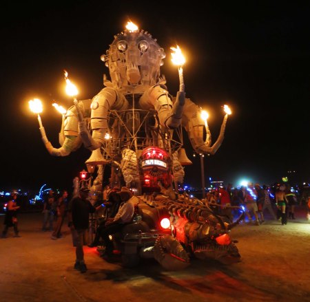 Here's a view of the giant octopus, El Pulpo Mechanico, at night, with flames coming out of his tentacles and his head. El Pulpo transported Sarandon around Burning Man when she first visited Black Rock City in 2013.
