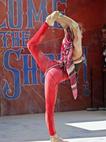 A stage in the carnival featured ongoing shows such as this flexible acrobat.