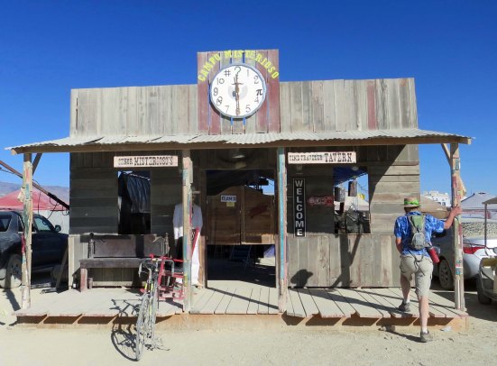 Camps at Burning Man have mastered the false fronts of the Old West. Free drinks were offered here at night, as they are by numerous camps. 