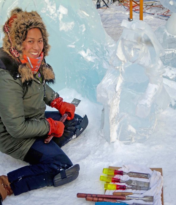 Anne Marie Tabardo takes a break from carving "Alice" at the 2016 World Ice Art Championships in Fairbanks.