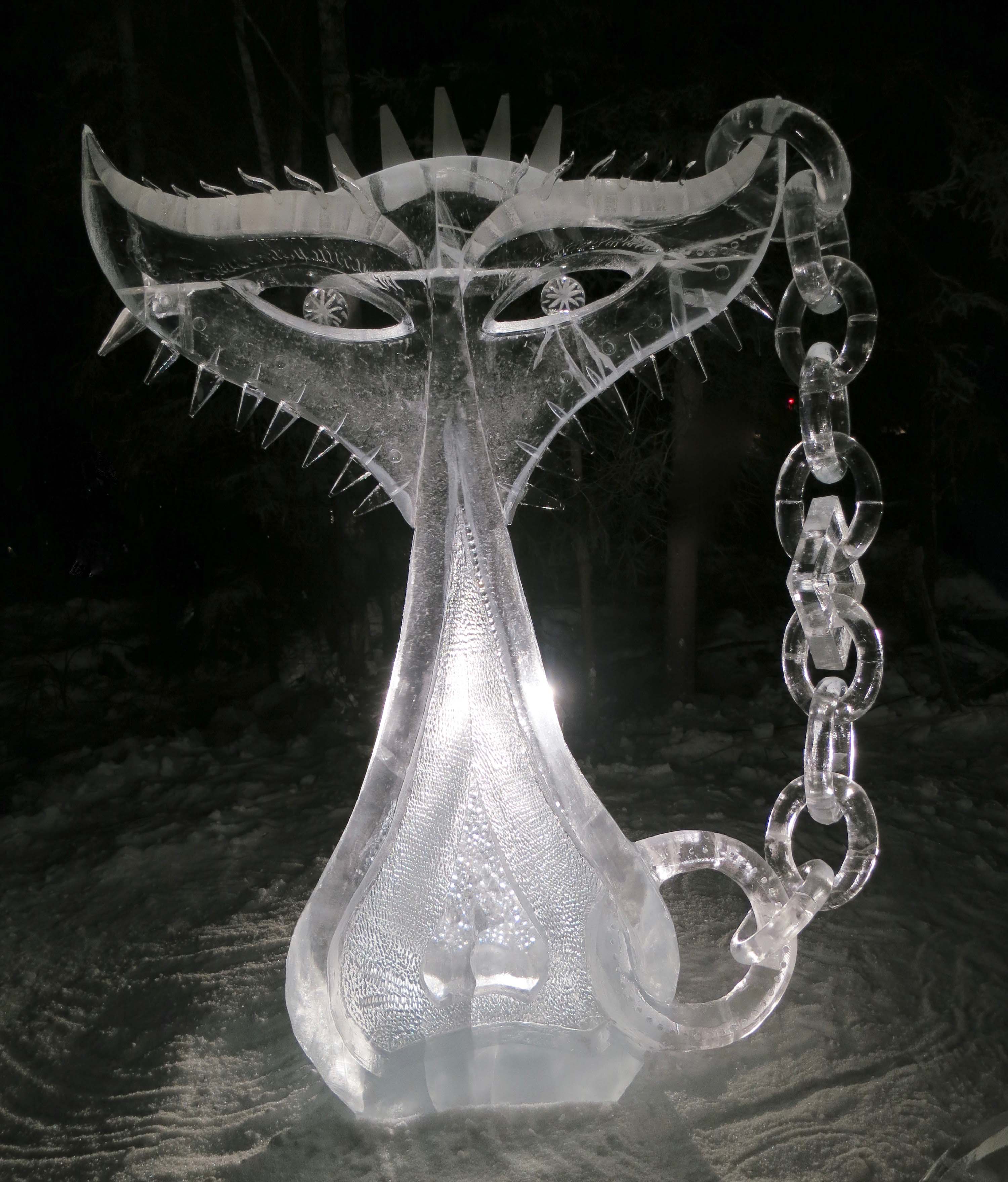 The sculpture "Stuck Up" by night at the 2016 Word Ice Art Championships in Fairbanks.