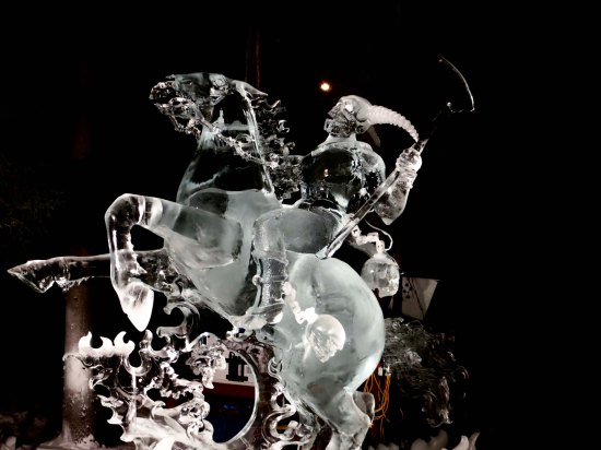 Ice art sculpture "Soul Collector" lit up at night at the 2016 World Ice Art Championshipsin Fairbanks, Alaska.