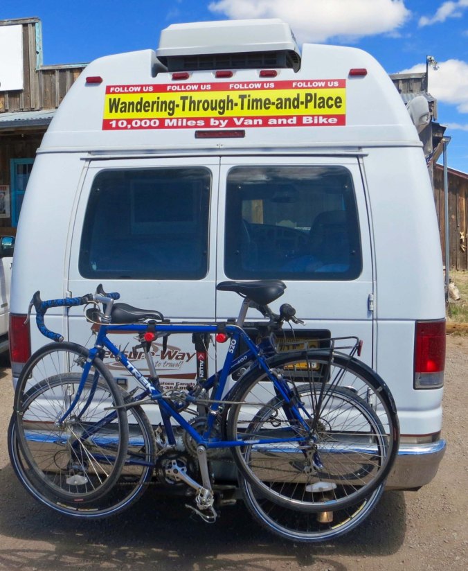 Quivera, the Van. We put a sing on Quivera to encourage people to follow my blog. The blue bike on the outside is the bike I rode around North America.