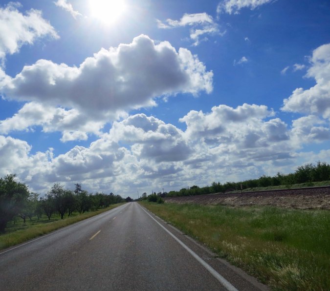 Cycling down Santa Fe Drive featured long, straight stretches, fruit trees and a train track.