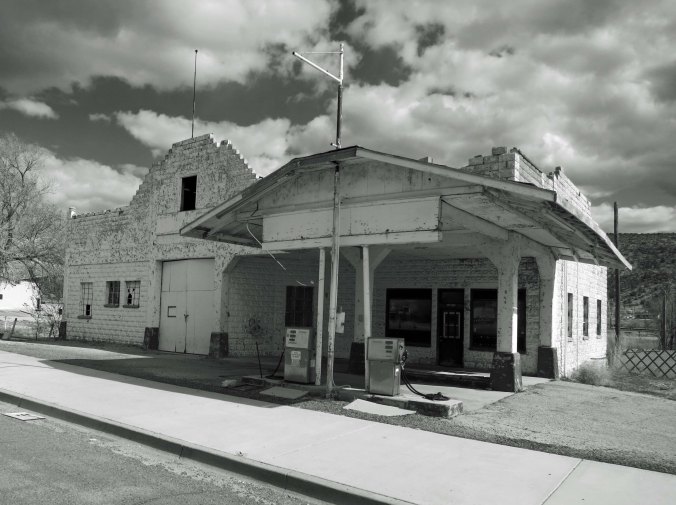 An old building that served as a gas station and garage during the heyday of Route 66. The gas pumps had been updated, but even they were no longer in use. I rendered the photo in black and white to represent the era.