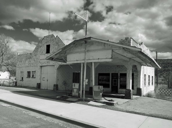 An old building that served as a gas station and garage during the heyday of Route 66. The gas pumps had been updated, but even they were no longer in use. I rendered the photo in black and white to represent the era.