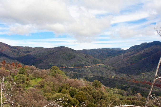 The distant road snakes its way up the mountain toward Greenhorn Pass.