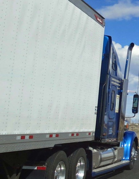 The normal view of an 18 wheeler from the perspective of a bicyclist.