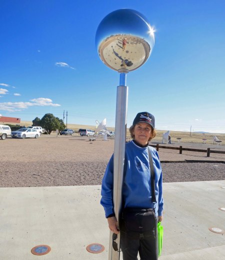 Peggy snuggles up to a sundial at the VLA, counting down the hours until she can watch "Independence Day" again.