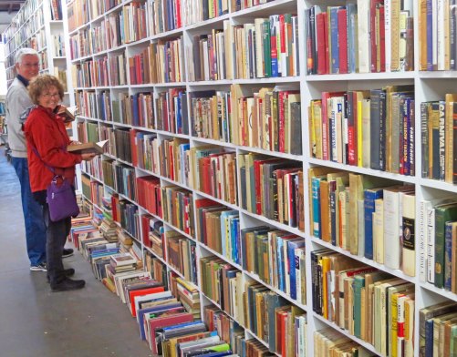 John and Peggy peruse the history section at Booked Up.