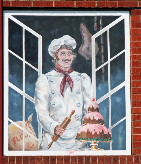 Bricked in windows across the road also featured fun murals.