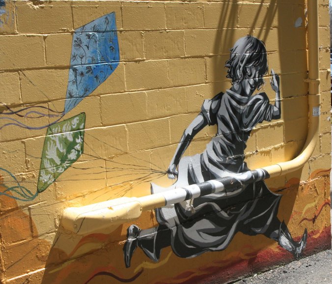 The mural also included this girl flying a kite.