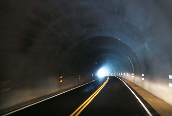 The lights from our van lit up the tunnel. Imagine your perspective from a bicycle. This was one time when I was ever so glad to see the light at the end of the tunnel.