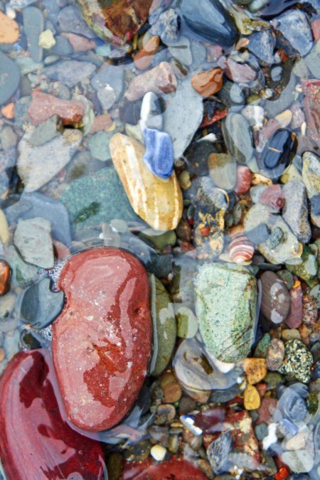 The wavelets were large enough to cover these rocks and bring out their colors.