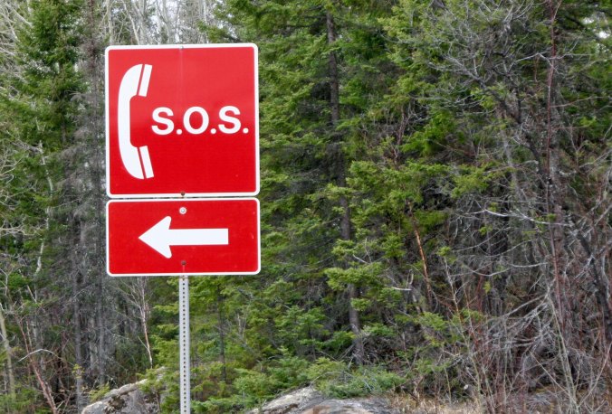 So maybe the road was paved, but how often do you see SOS signs along paved roads. 167 had several pointing to lone phone booths. I don't remember any when I bike the road.
