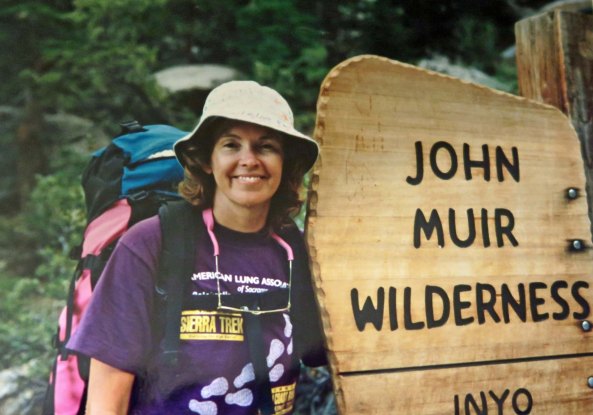 A 1993 photo of Peggy one year after we had married. Always up for an adventure, she had just finished a 150 mile backpack trip down the John Muir Trail I had led. More to the point she had just finished hiking a 16 mile day with a 40 pound pack up and over Mt. Whitney that had included 9000 feet of elevation gain and loss. And she was still smiling!