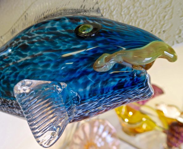 Glass fish with character at Glass Forge in Grants Pass, Oregon.