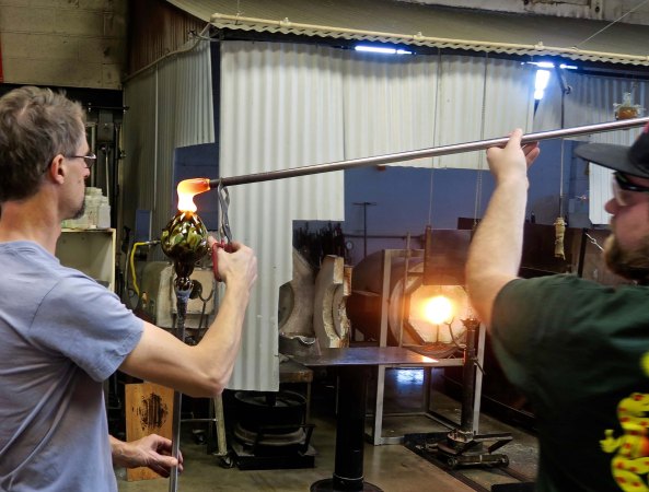 Top is added to vase at Glass Forge in Grants Pass, Oregon.