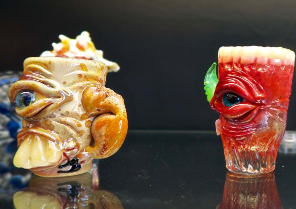 Humorous mugs created by the artists working at the Glass Forge in Grants Pass, Oregon.