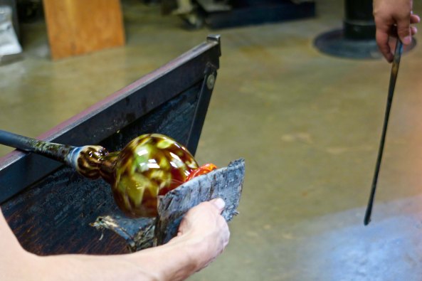 Shaping a top on a vase at the Glass Forge in Grants Pass, Oregon.