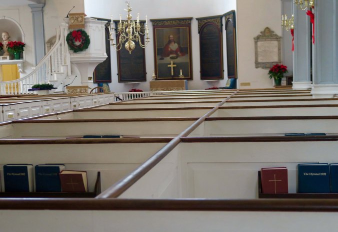 Looking across box pews toward the altar at the Old North Church in Boston.