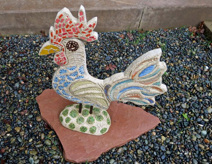 Meet Doodle (as in cock-o-doodle-do). Doodle resides in our front yard and was created by Jeremy Crisswell who worked as an apprentice under
