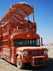 Orange bus mutant vehicle at Burning Man.