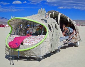 Fish eating fish with provocative tongue mutant vehicle at Burning Man.
